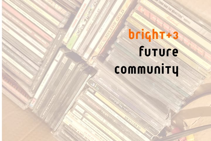 Bright+3 Future Community and a whole mess of compact discs in the background.