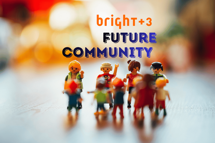 bright+3 future community - lego type people get together on a table and look rather happy