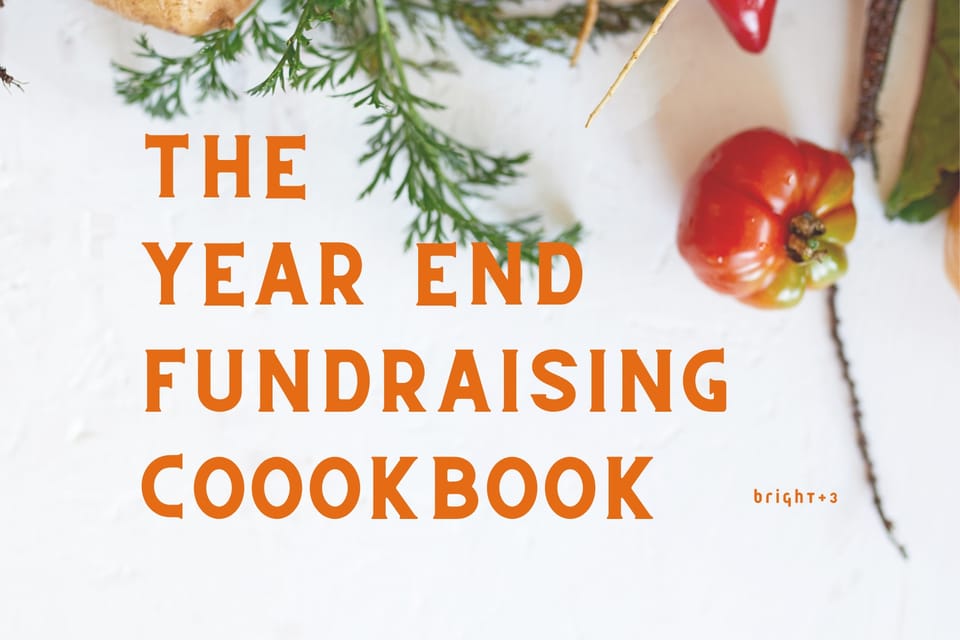 The Year End Fundraising Cookbook. The photo includes some spices, tomatoes, peppers and more. 